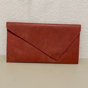 Nisolo red leather distressed clutch